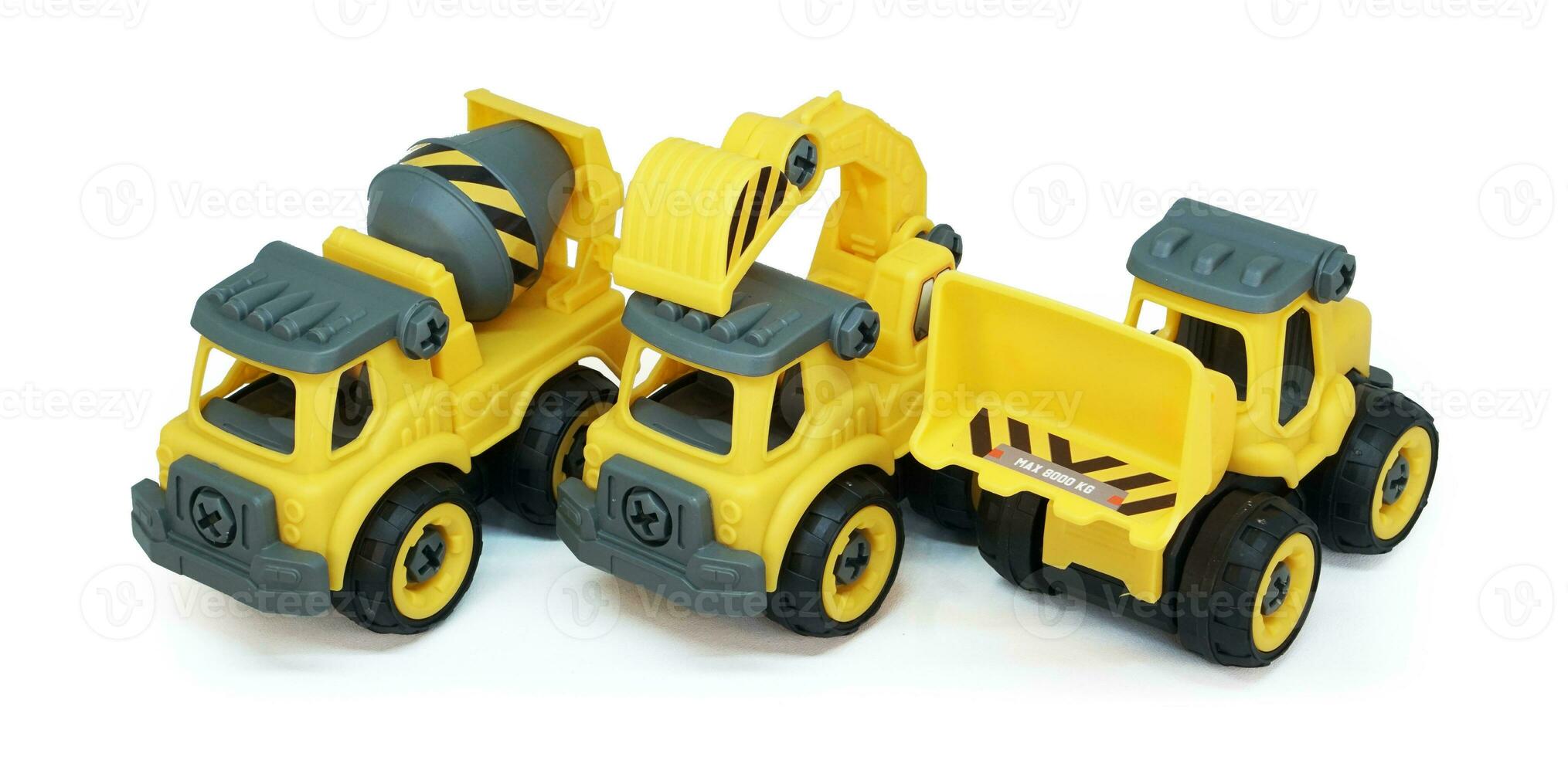 heavy construction toy line up in a row isolated on white background. plastic toy consist of truck, mixer and loader. photo