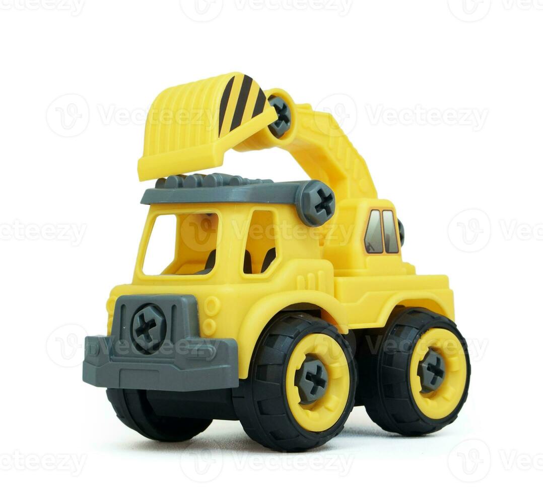 Yellow plastic truck toy isolated on white background. construction vechicle truck. photo