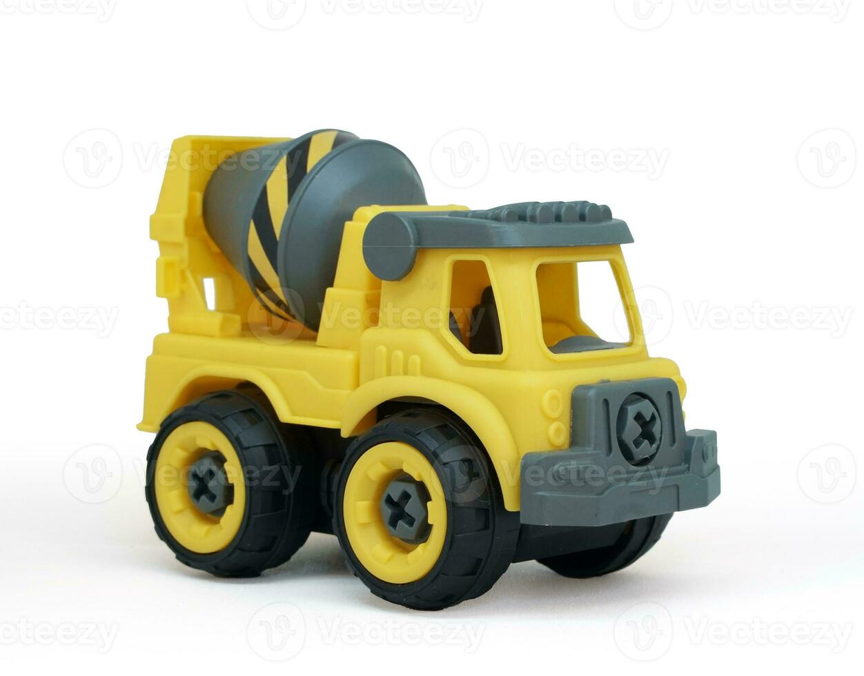 Yellow plastic concrete mixer truck toy isolated on white background. construction vechicle truck. photo