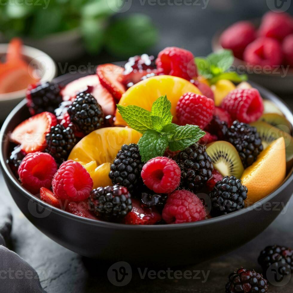 Colorful assortment of fresh fruits tossed together in a white bowl photo