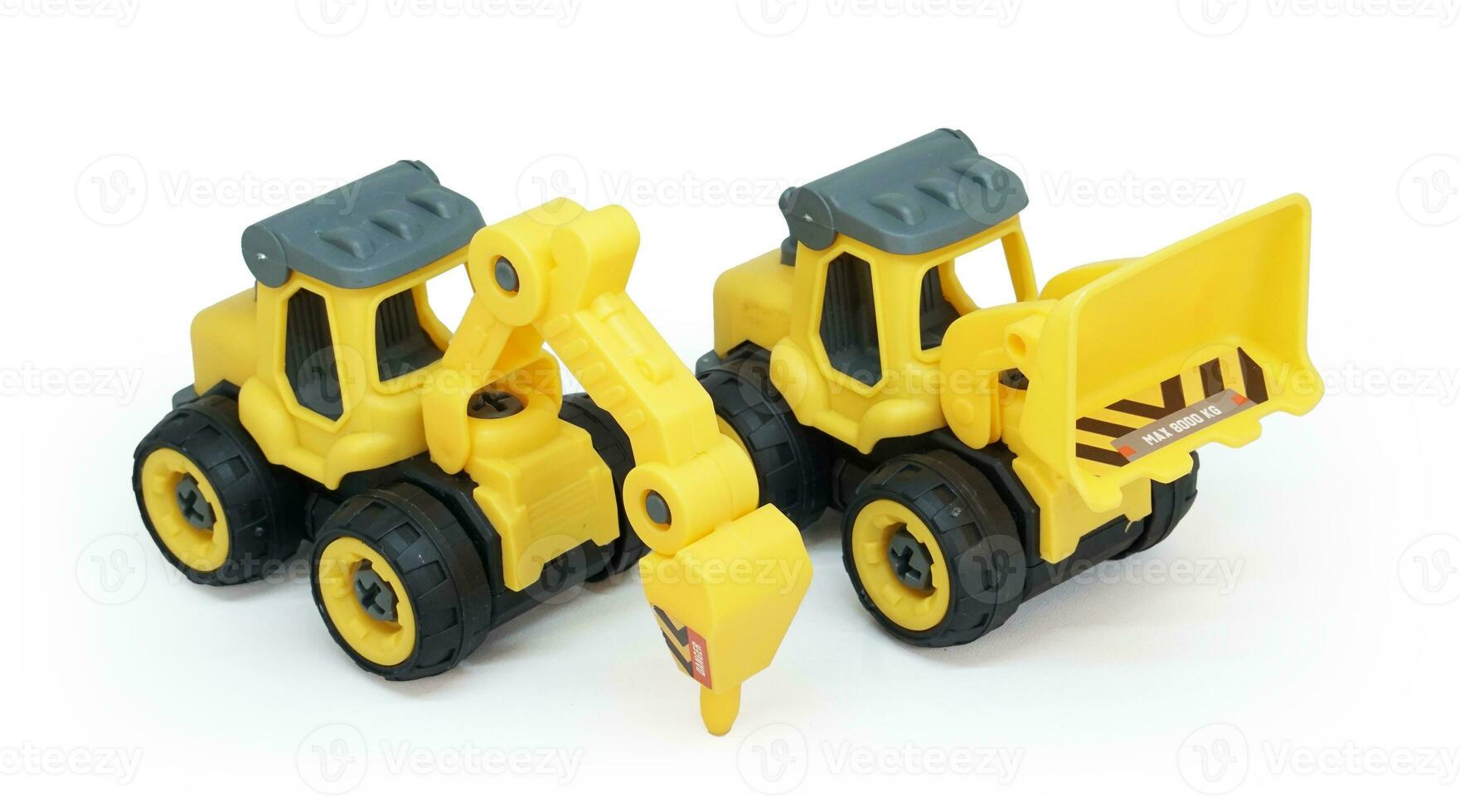 yellow plastic toy of tractor drill and bulldozer or loader isolated on white background. heavy construction vehicle. photo
