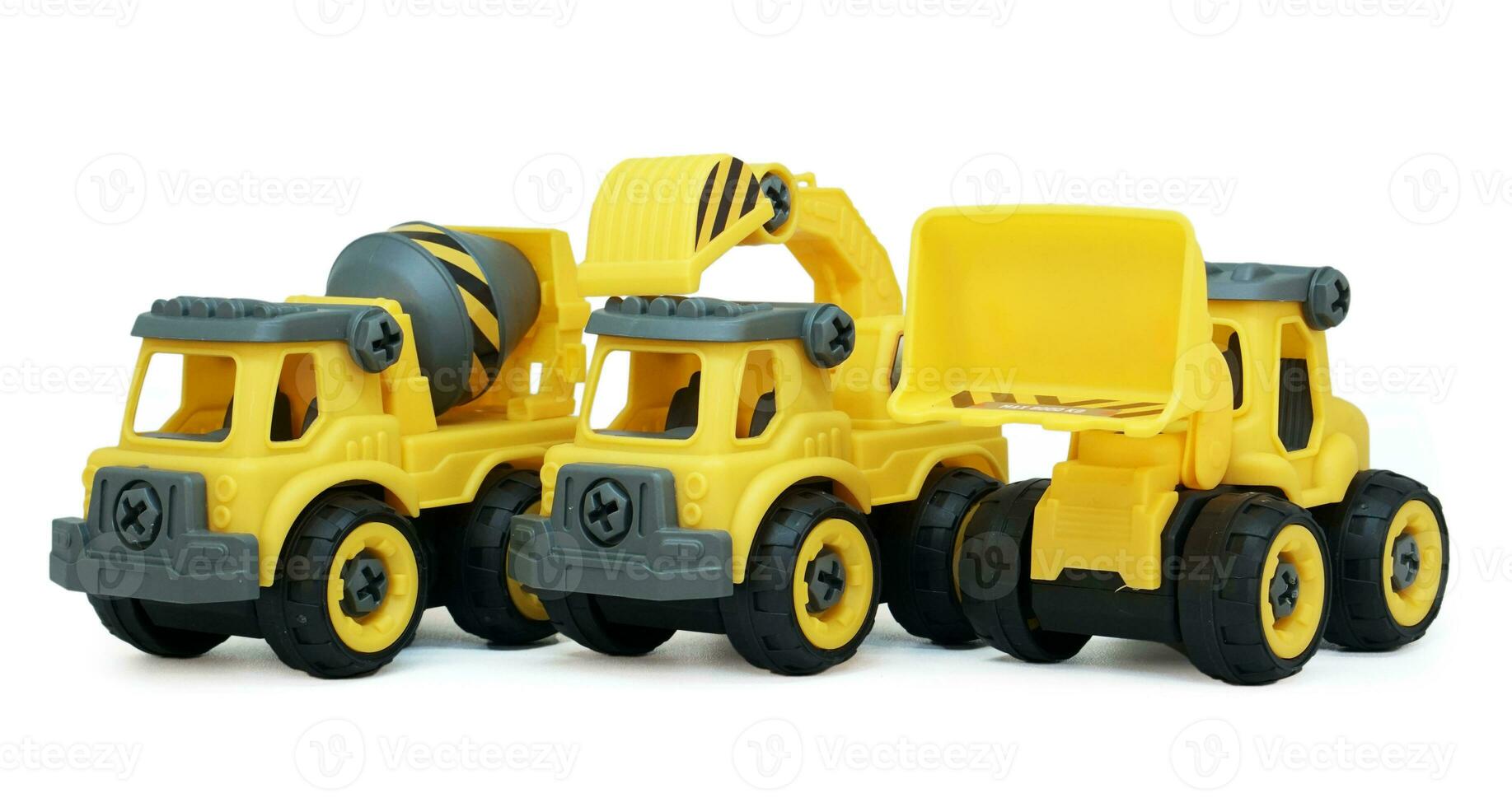 heavy construction toy line up in a row isolated on white background. plastic toy consist of truck, mixer and loader. photo