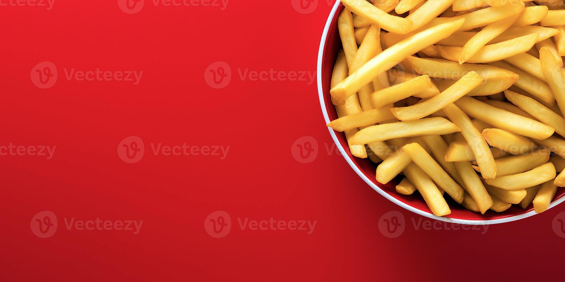 colorful minimalist bowl of crispy French fries top view layout isolated on red background, photo