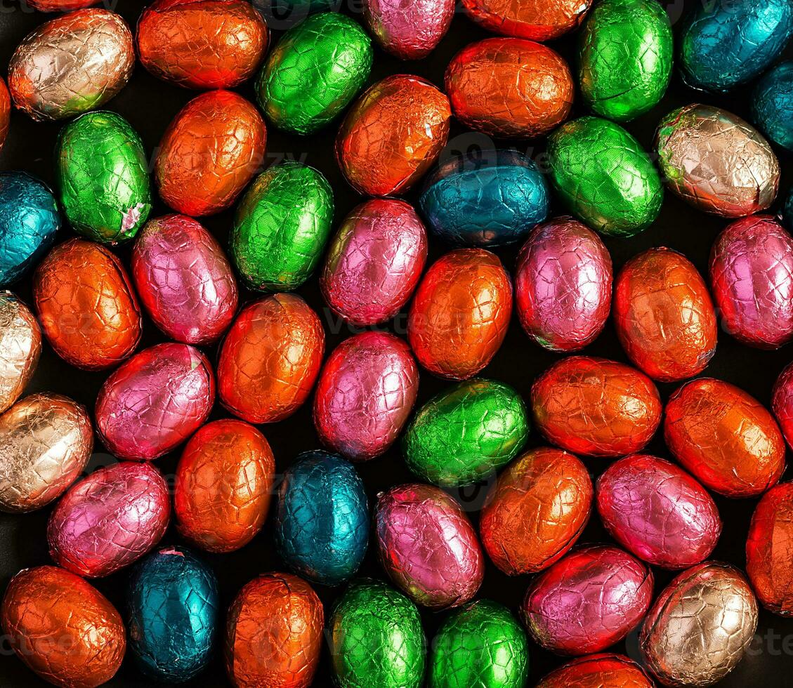 Colorful Easter eggs background. Chocolate Easter eggs texture. Top view photo