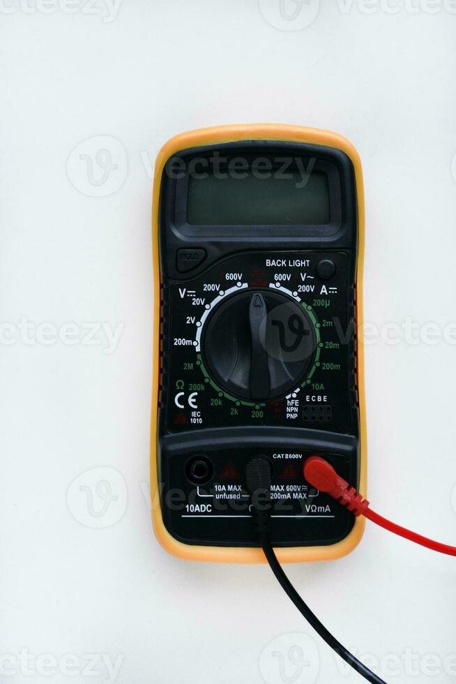 Multimeter on a white background. Voltage and current meter. photo