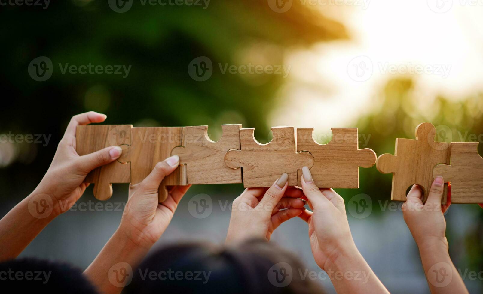 Jigsaw puzzle pieces group together, unite strength, unity, teamwork. communication connection teamwork concept photo