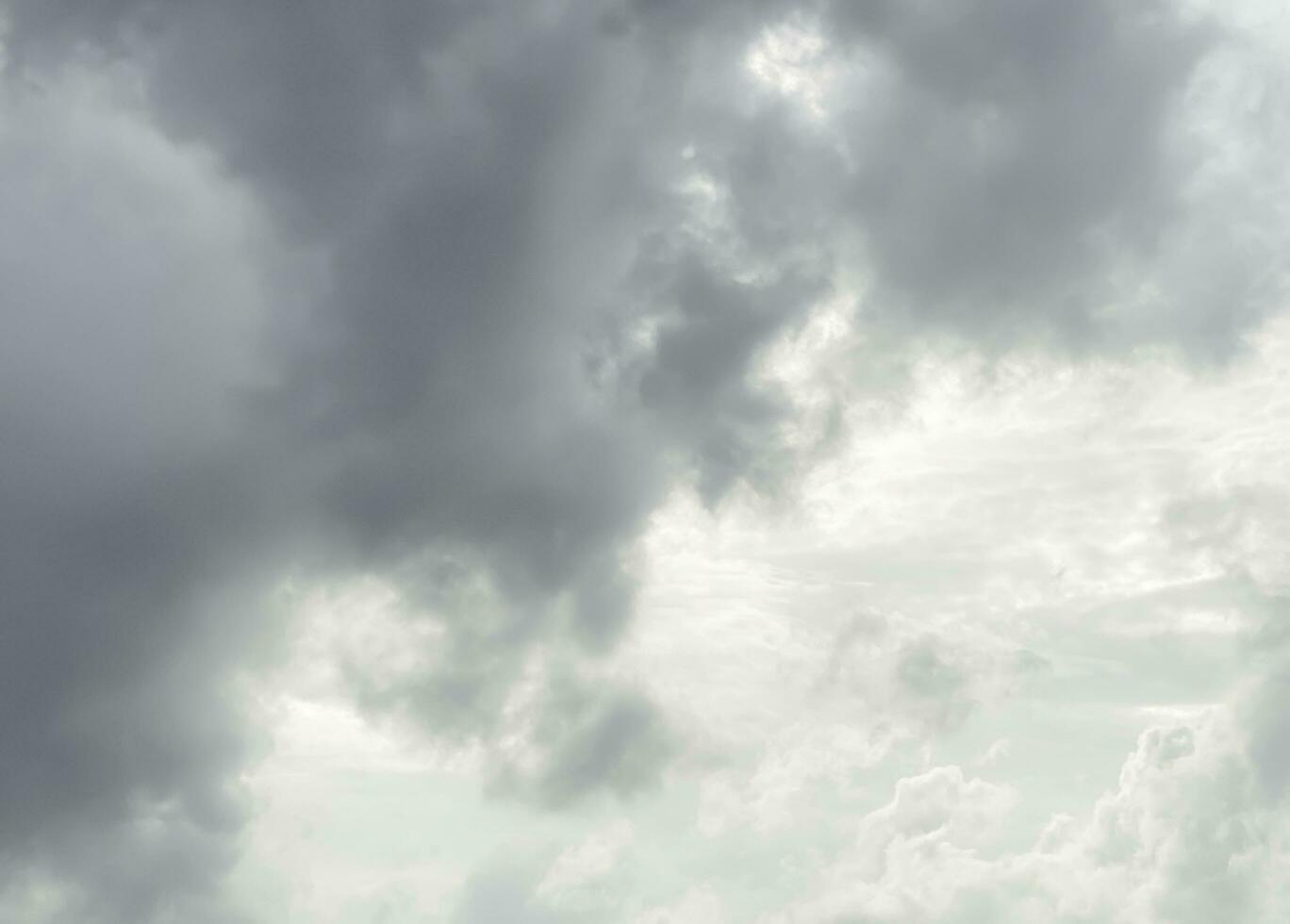 Black gray clouds form causing rain, and seasonal storms. The rain clouds that were formed caused a thunderstorm. For weather forecasters reporting the weather in the rainy season or stormy season. photo