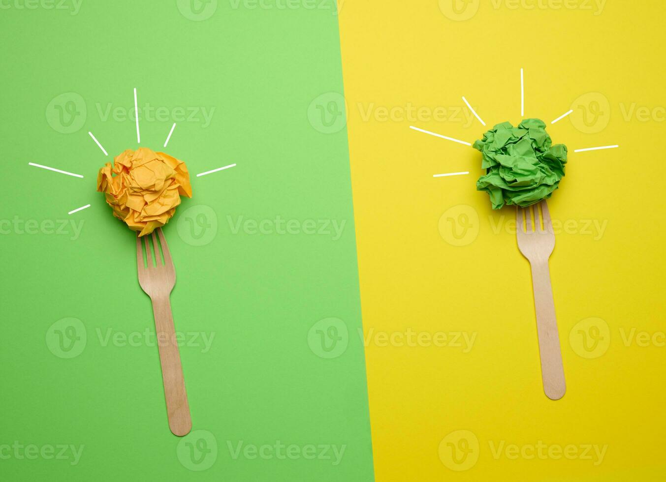 Concept of inspiration with new ideas, the search for creative solutions, crumpled sheets of paper in the form of balls on a green yellow background photo