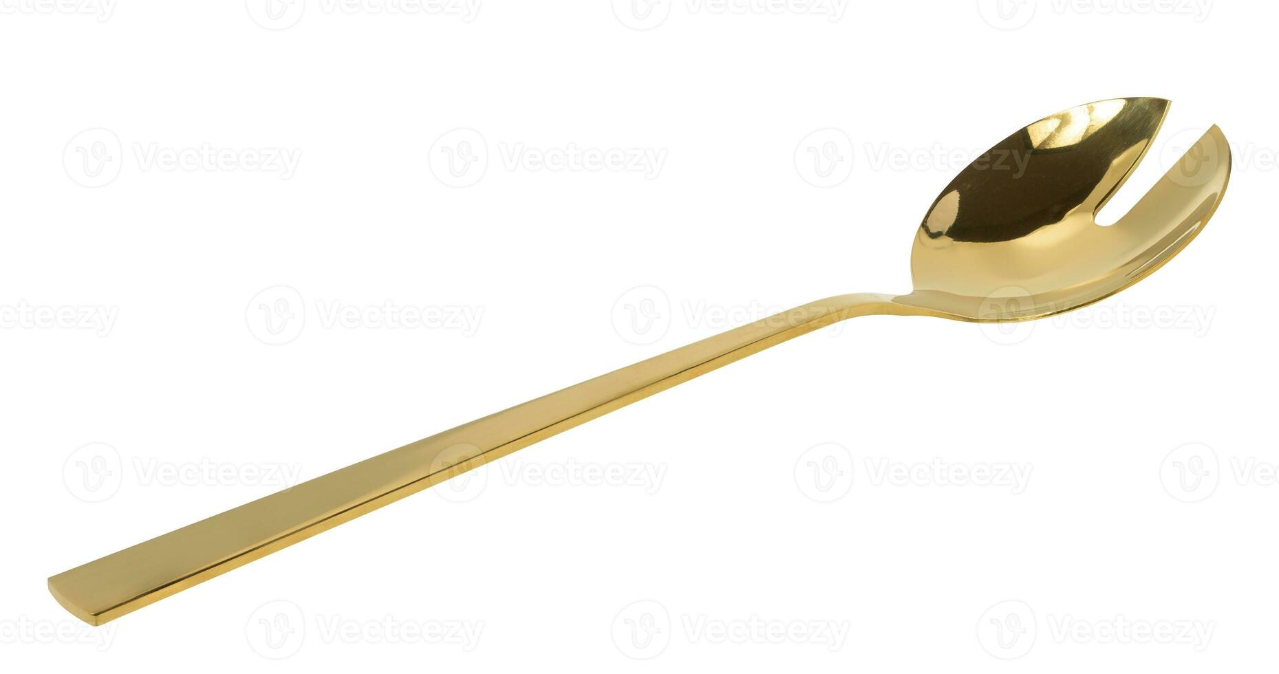 Golden spoon for stirring salad on white isolated background photo