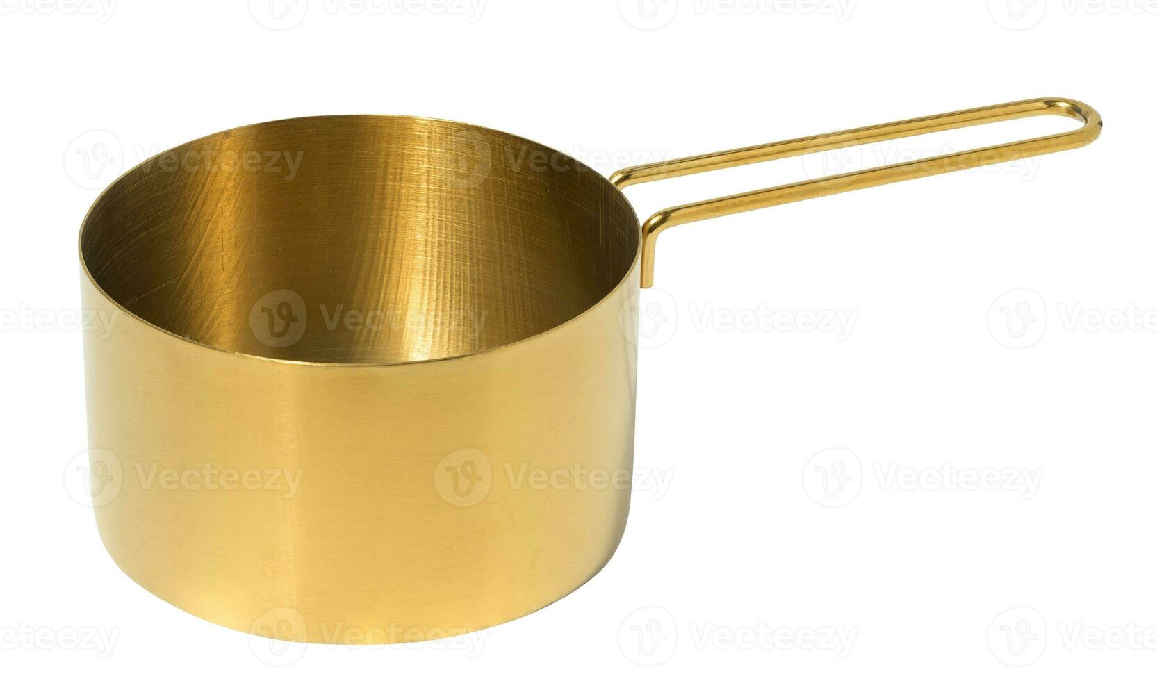 Copper ladle for cooking on a white isolated background photo