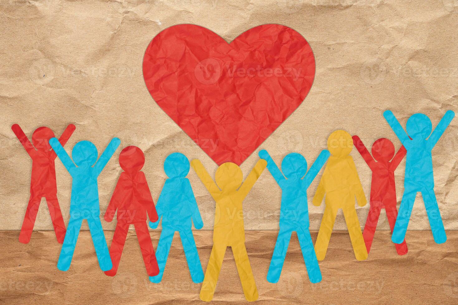 Paper colorful people and a red heart. The concept of love and kindness, donation photo