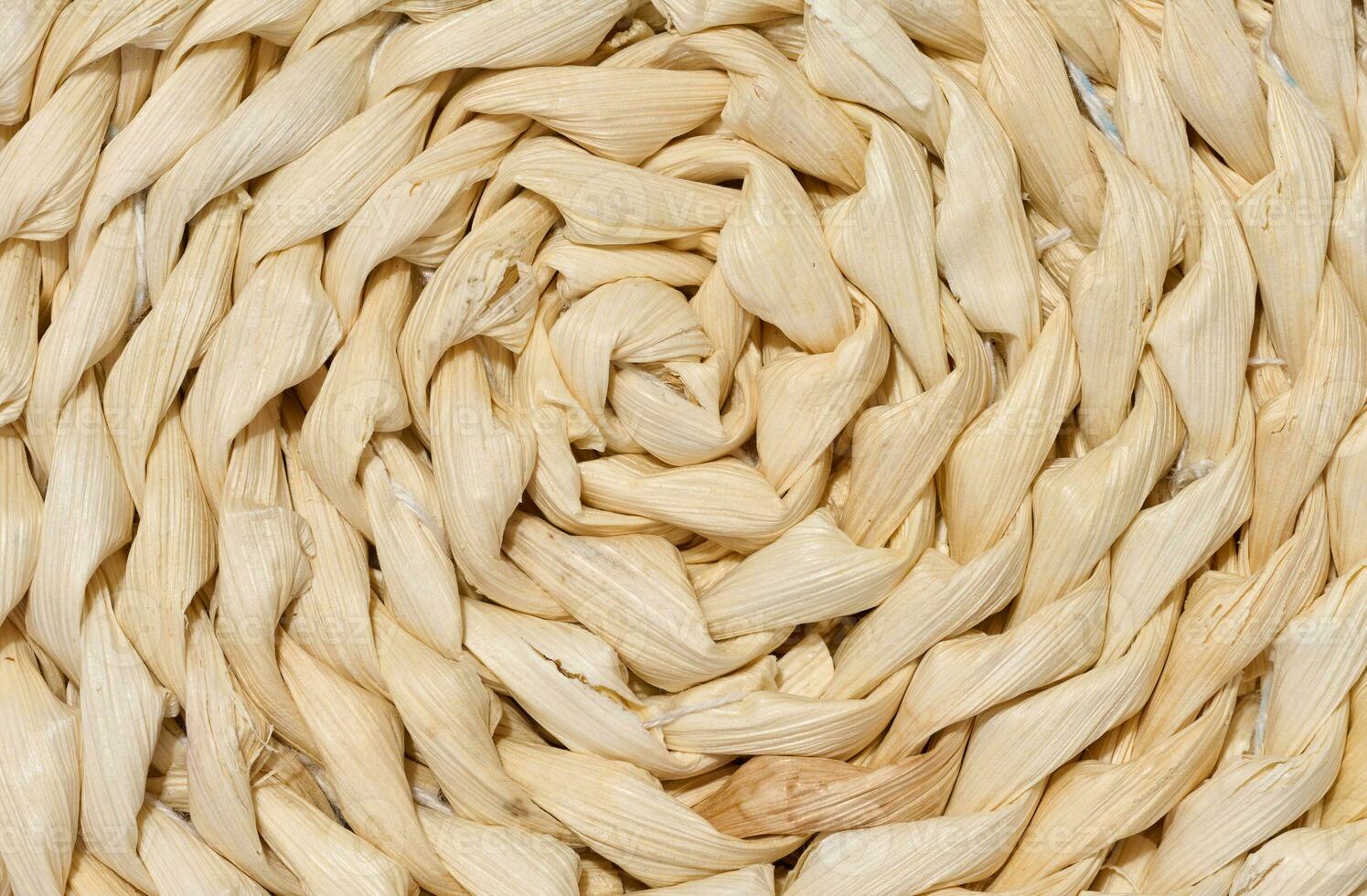 Texture of knitted yellow straw rug photo
