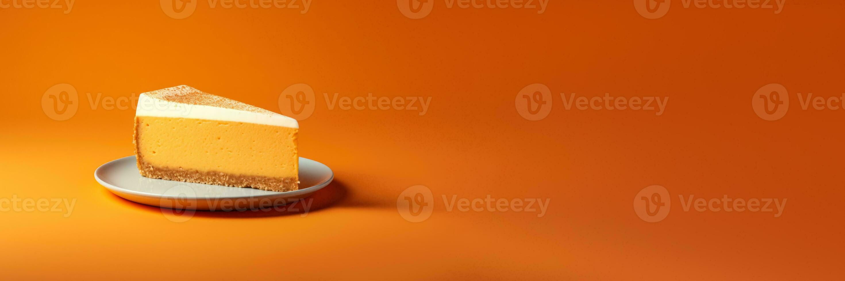 Minimalist designed pumpkin cheesecake creation isolated on a vibrant gradient background photo