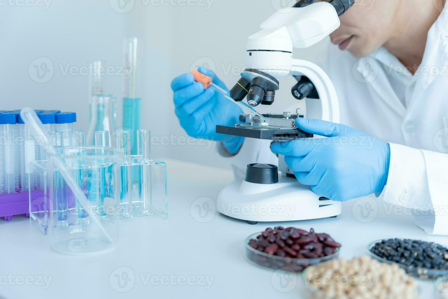 Scientist analyze biochemical samples in advanced scientific laboratory. Medical professional use microscope look microbiological developmental of viral. Biotechnology research in science lab. photo