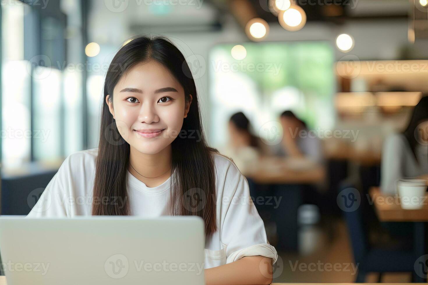 Young asian female photographer or travel blogger working on laptop  computer at minimalist Japanese style coffee shop Stock Photo - Alamy