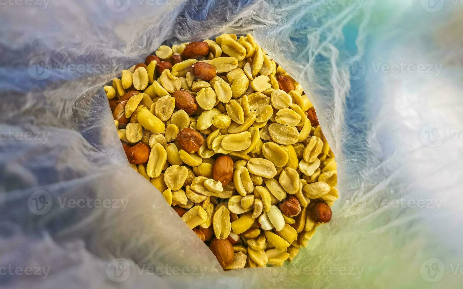Various nuts in bag pecans peanuts pumpkin sunflower seeds almonds. photo