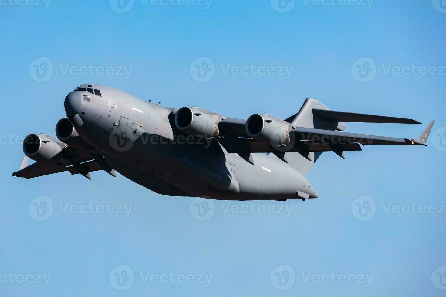 Untitled military transport plane at air base. Airport and airfield. Air force and army flight operation. Aviation and aircraft. Air lift. Military industry. Fly and flying. photo