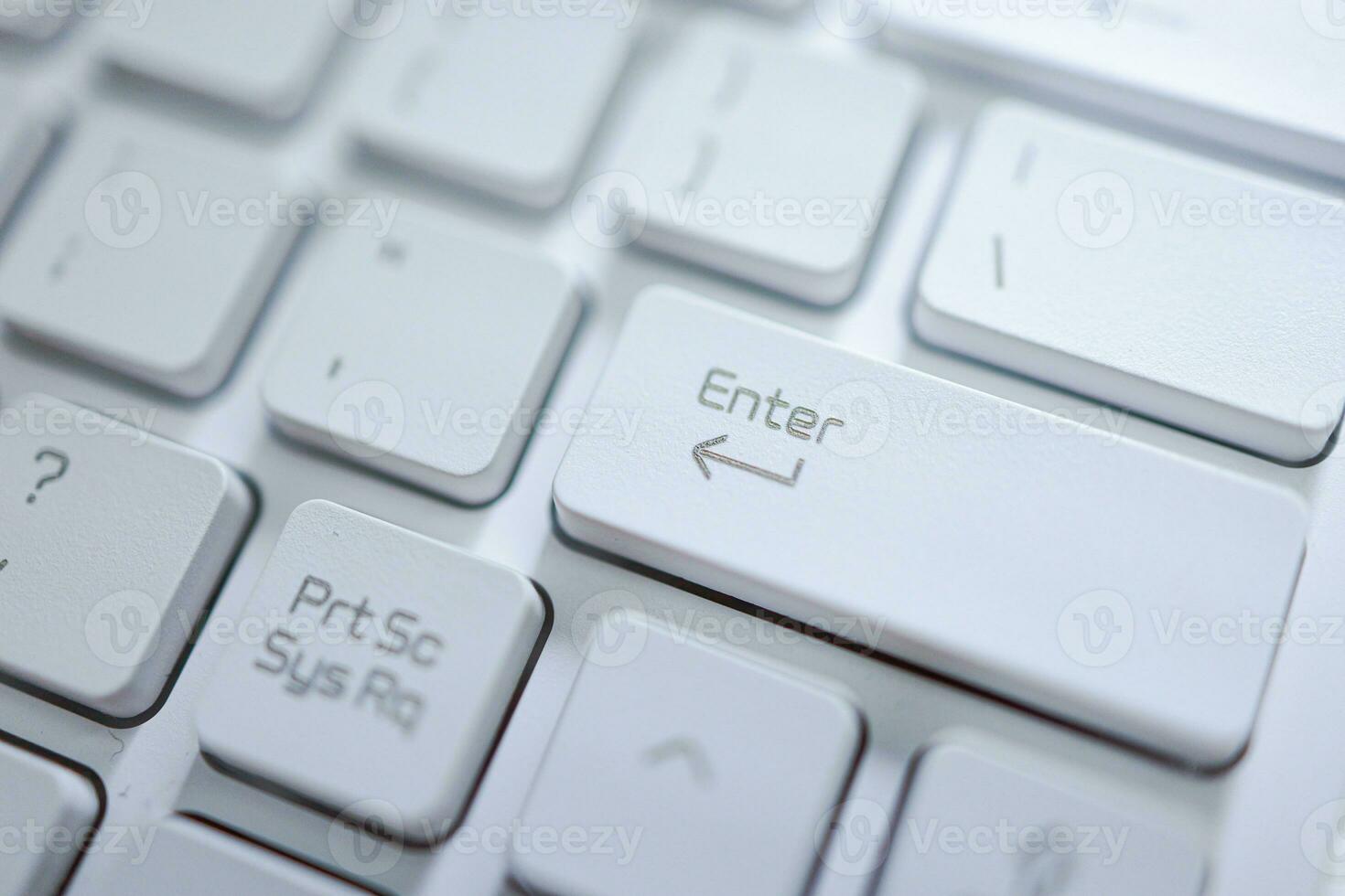 Hands of business woman Pressing enter button on computer keyboard photo