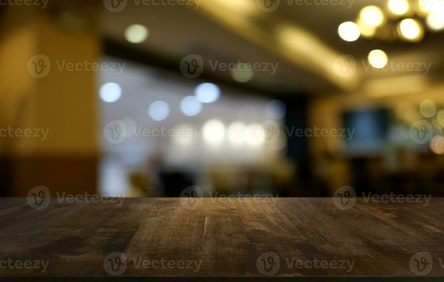 Wood Table Top in Blur Background room interior with empty copy space. photo