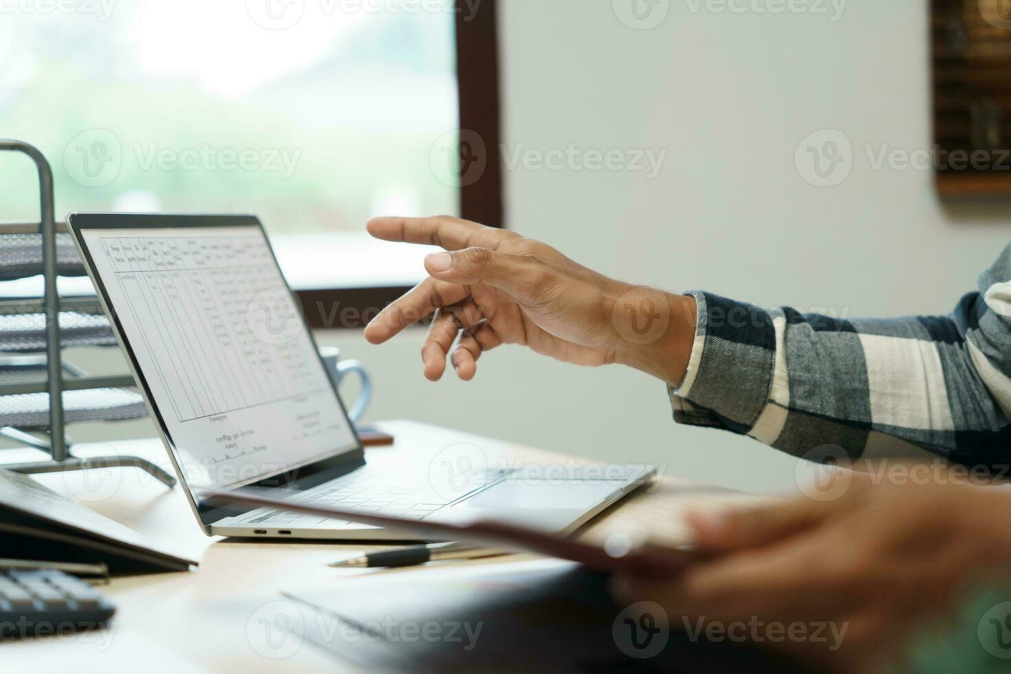 Attractive confident Hispanic Business man using laptop computer and professional working investor start up project business planning in office photo