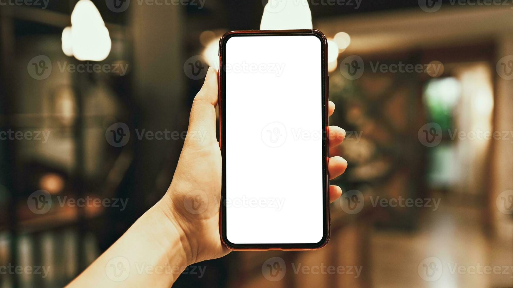 Women's hands holding cell telephone blank copy space screen. smartphone with blank white screen isolated on white background . smart phone with technology concept photo