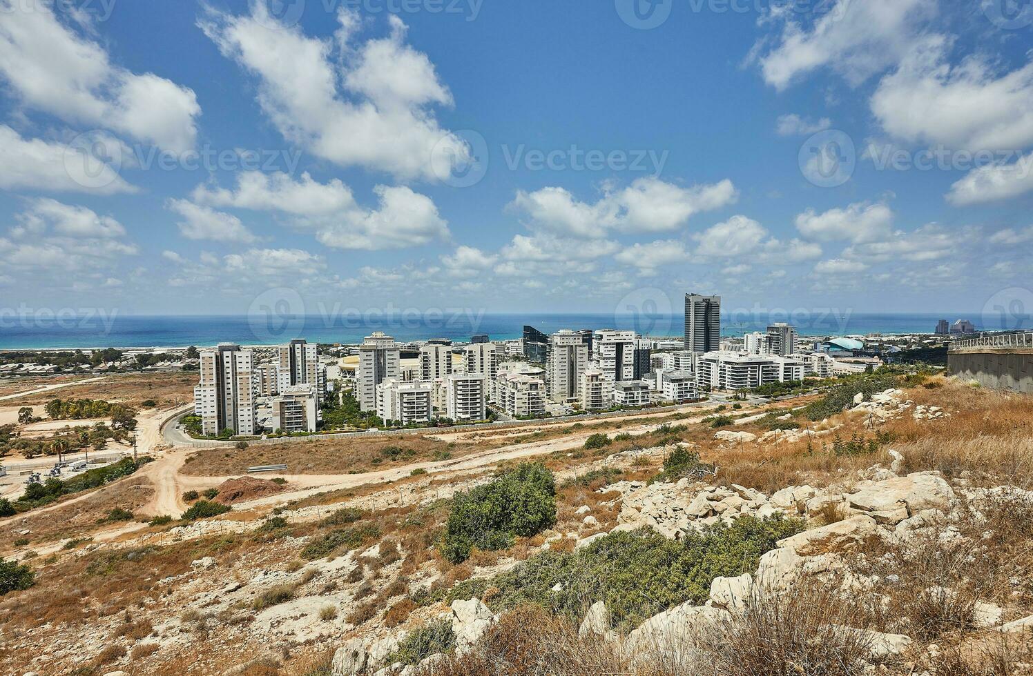 View of the Naot Peres district of Haifa, the stadium and the sea coast photo