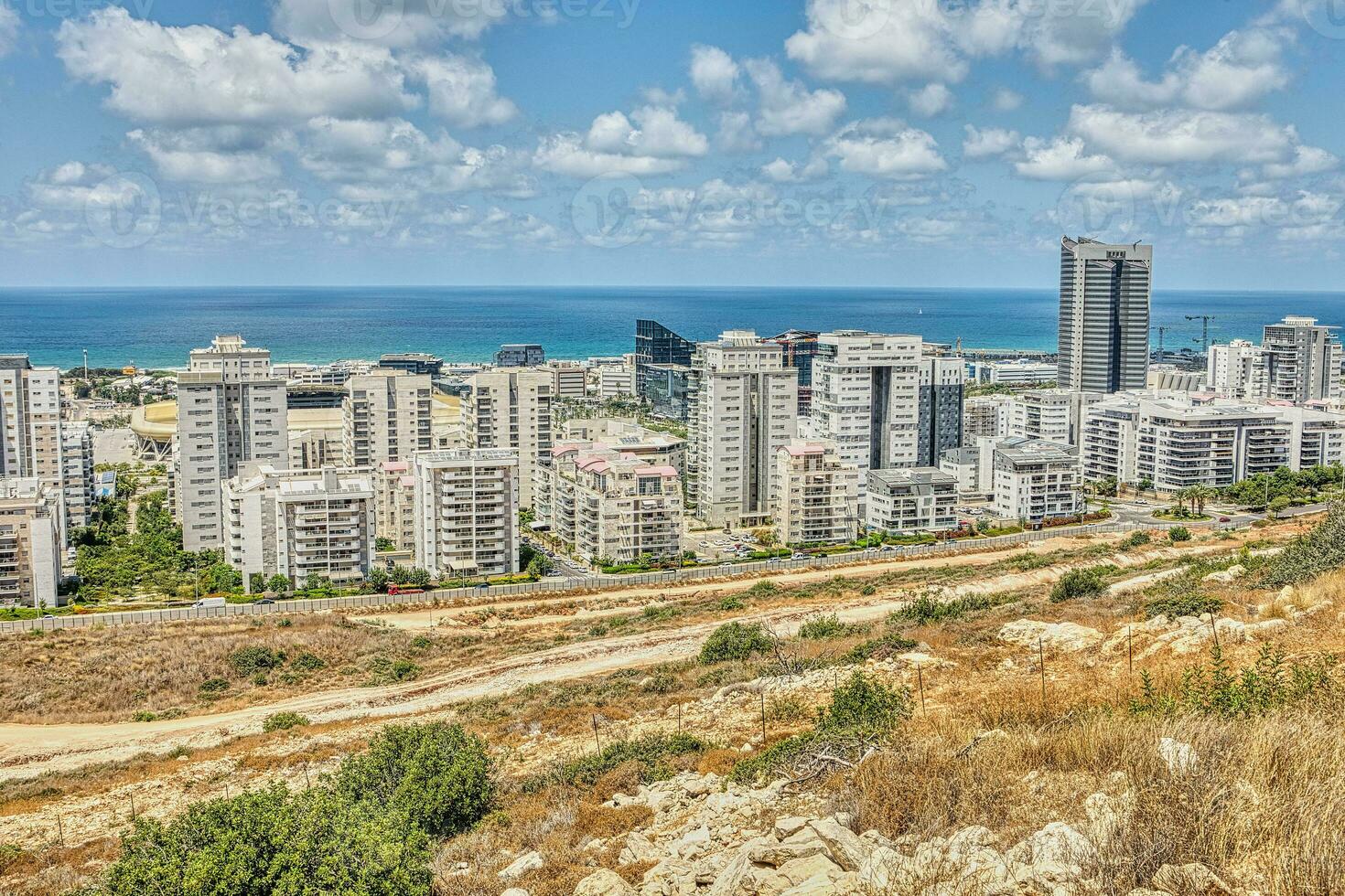 View of the Naot Peres district of Haifa, the stadium and the sea coast photo