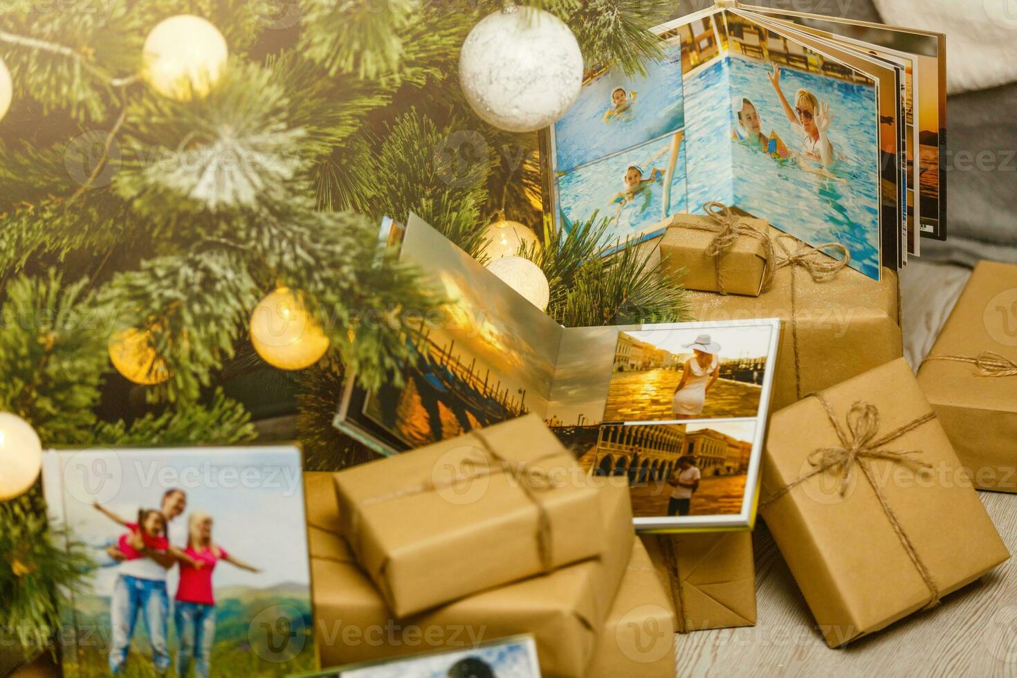 book together near Christmas tree in front of fireplace photo