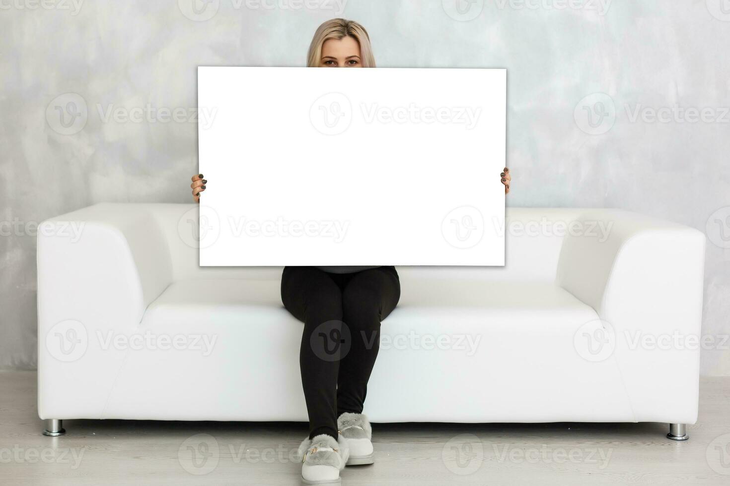 Woman holding a blank board for your text photo