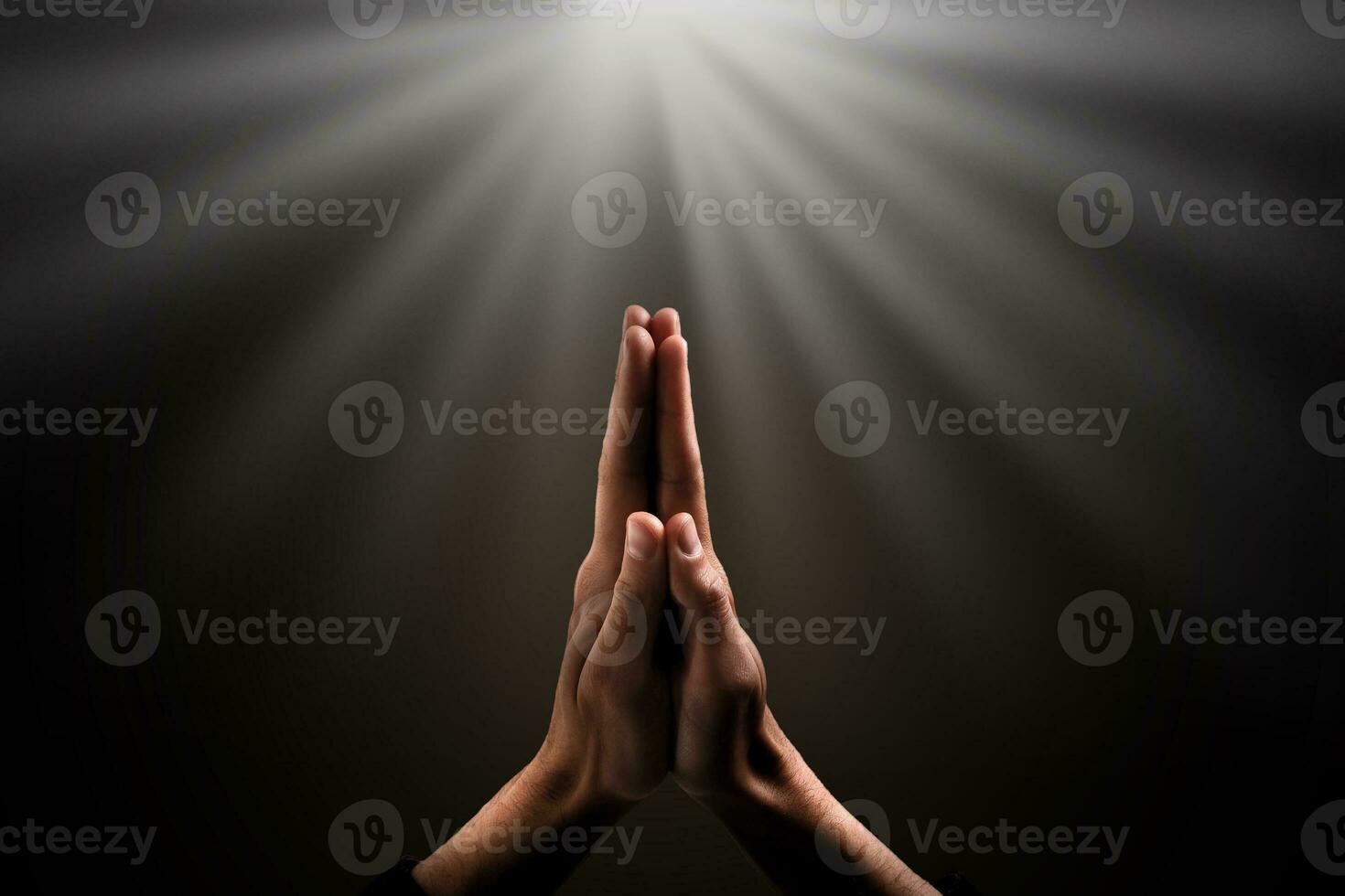 Man hands praying in dark background photo