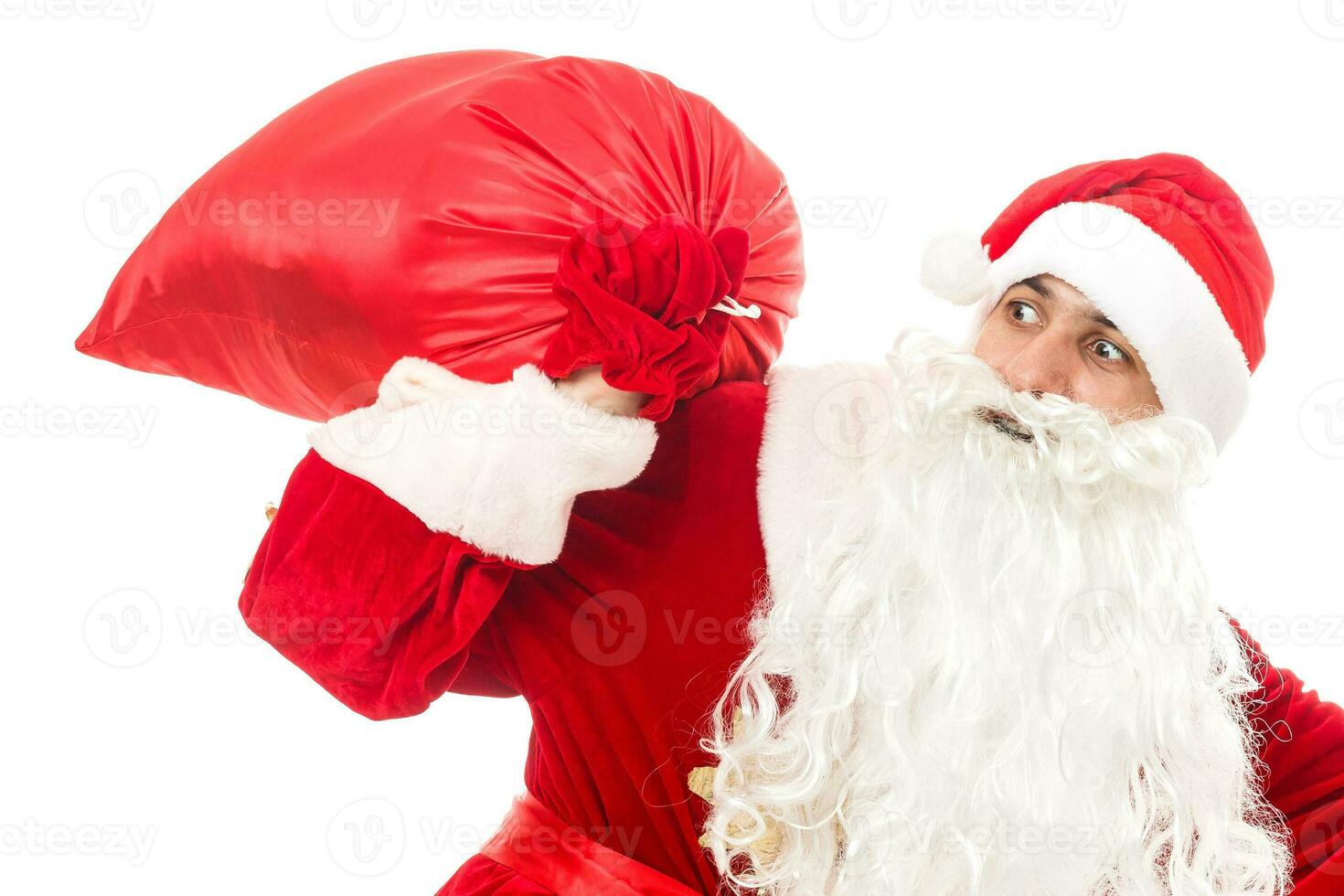Santa claus holding a gifts against white background photo