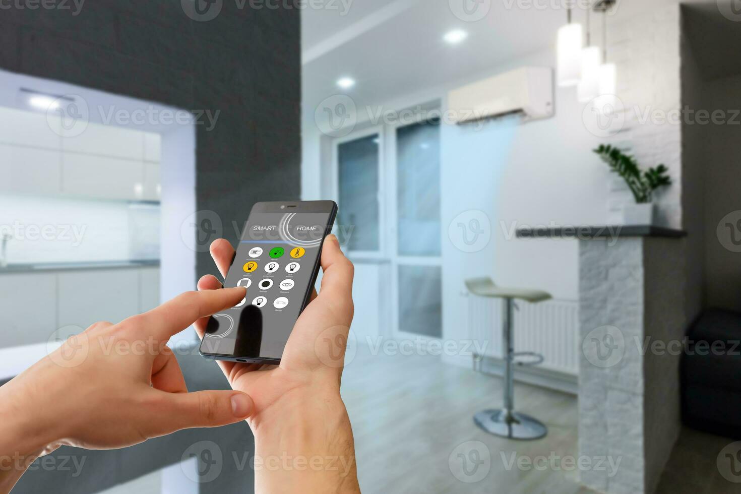 smart house, home automation, device with app icons. Man uses his smartphone with smarthome security app to unlock the door of his house. photo