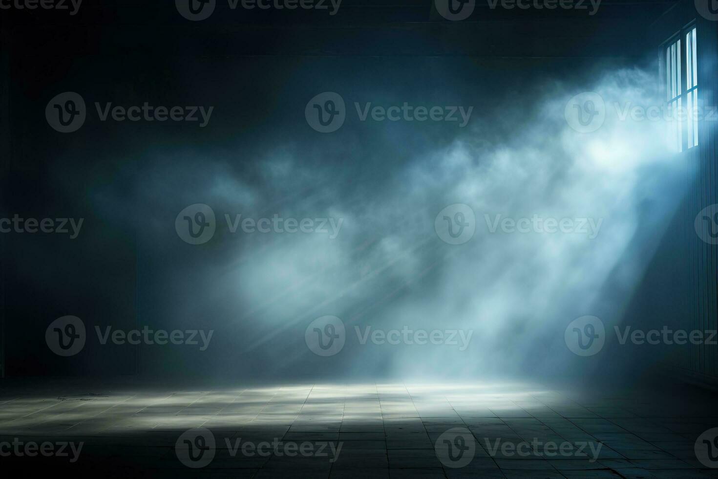 Dark, empty prison cell with rays of light in the smoke and a spot of light on the floor. photo