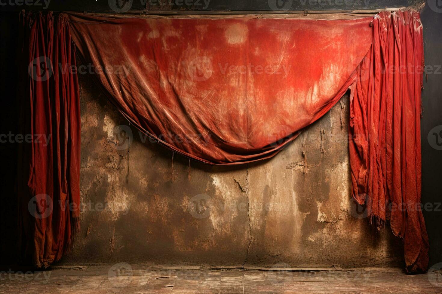 torn dirty red theater curtain against the background of a brown wall with cracks on it. Long time Abandoned scene photo