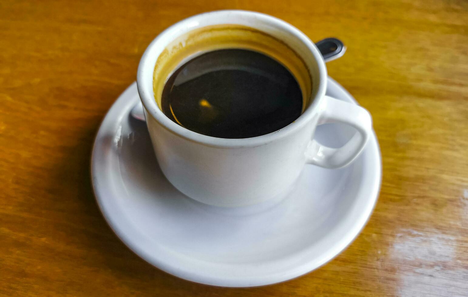 Cup of americano black coffee in restaurant cafe in Mexico. photo