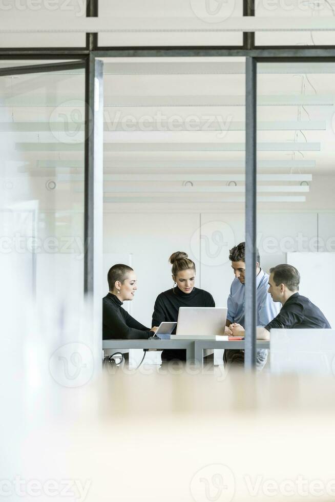 Young business people having a meeting in office photo