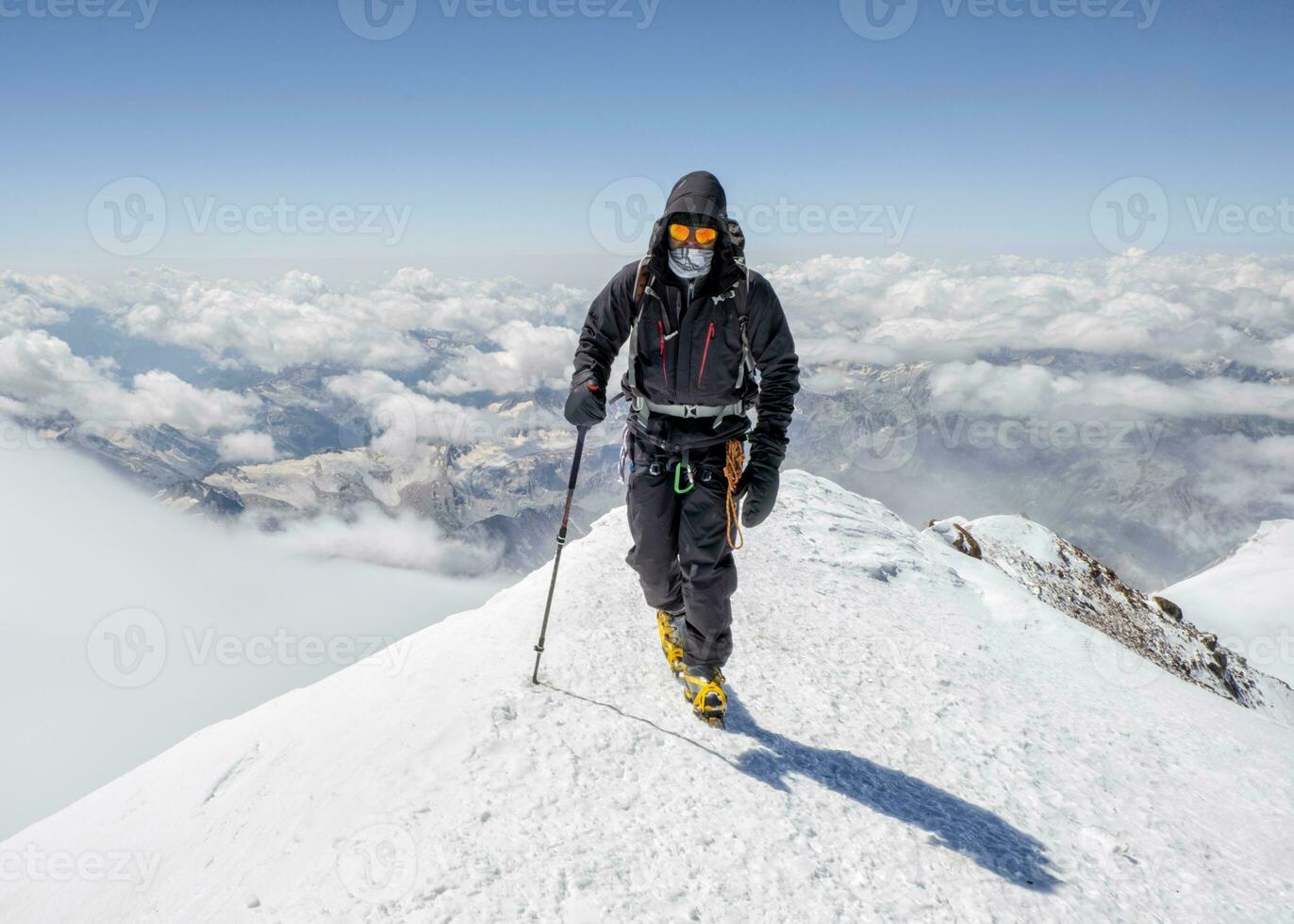 Russia, Upper Baksan Valley, Caucasus, Mountaineer ascending Mount Elbrus photo