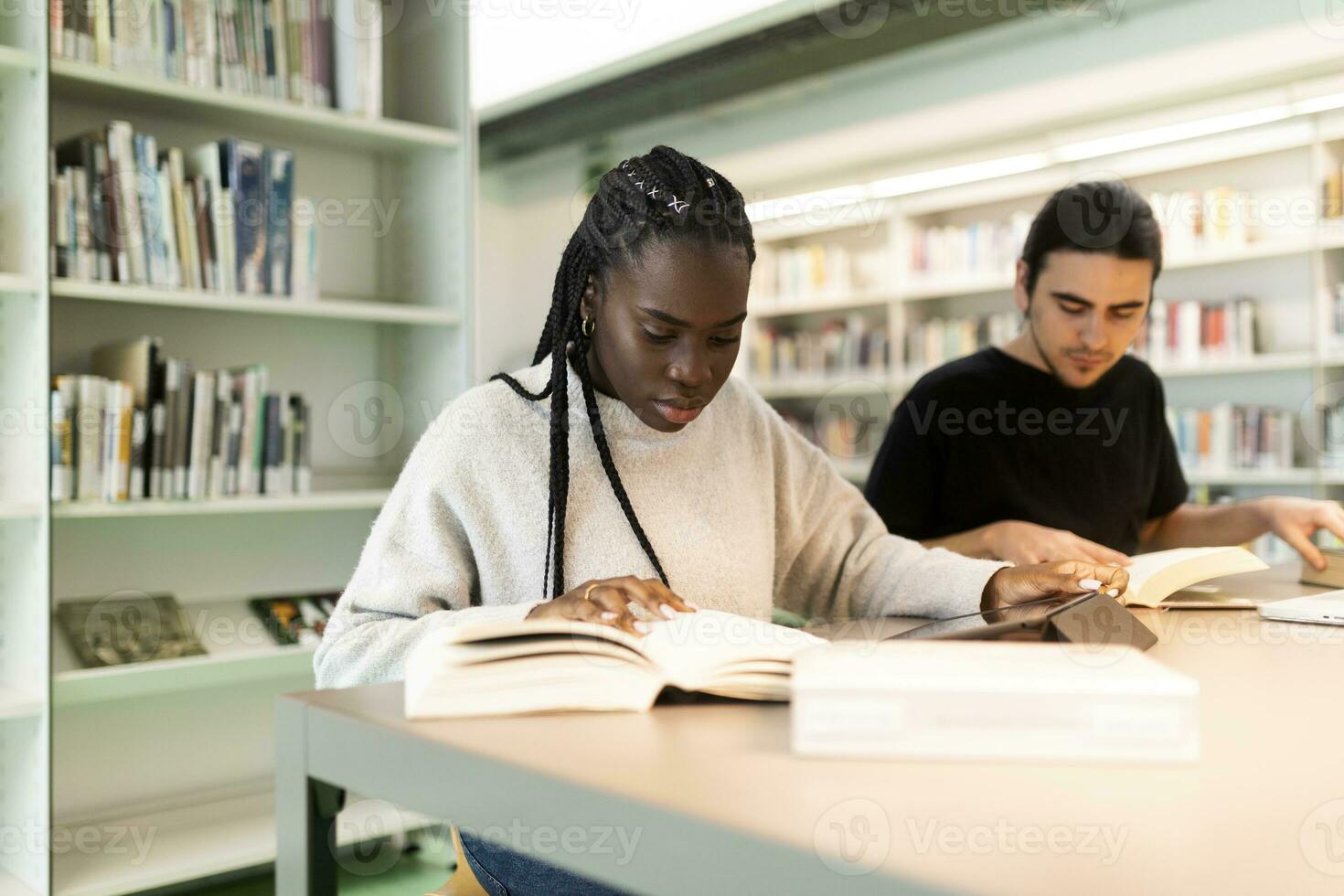 Two students learning in a library photo