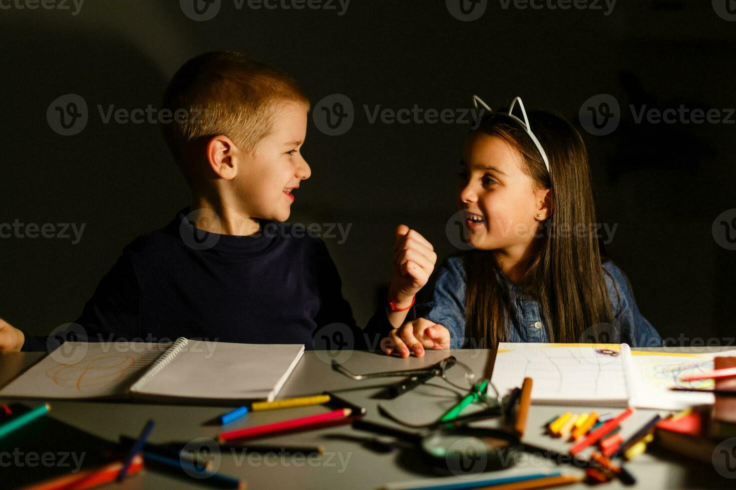 children do homework at night photo