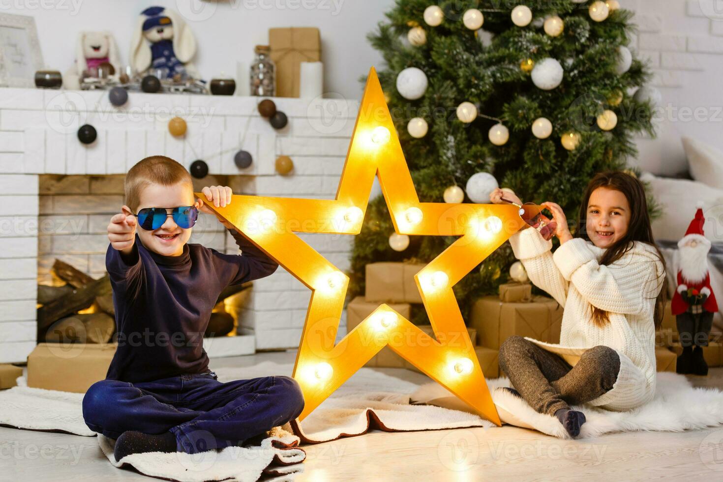 Teenager and star, portrait of beautiful boys and nice girl against garland of lights, studio photo