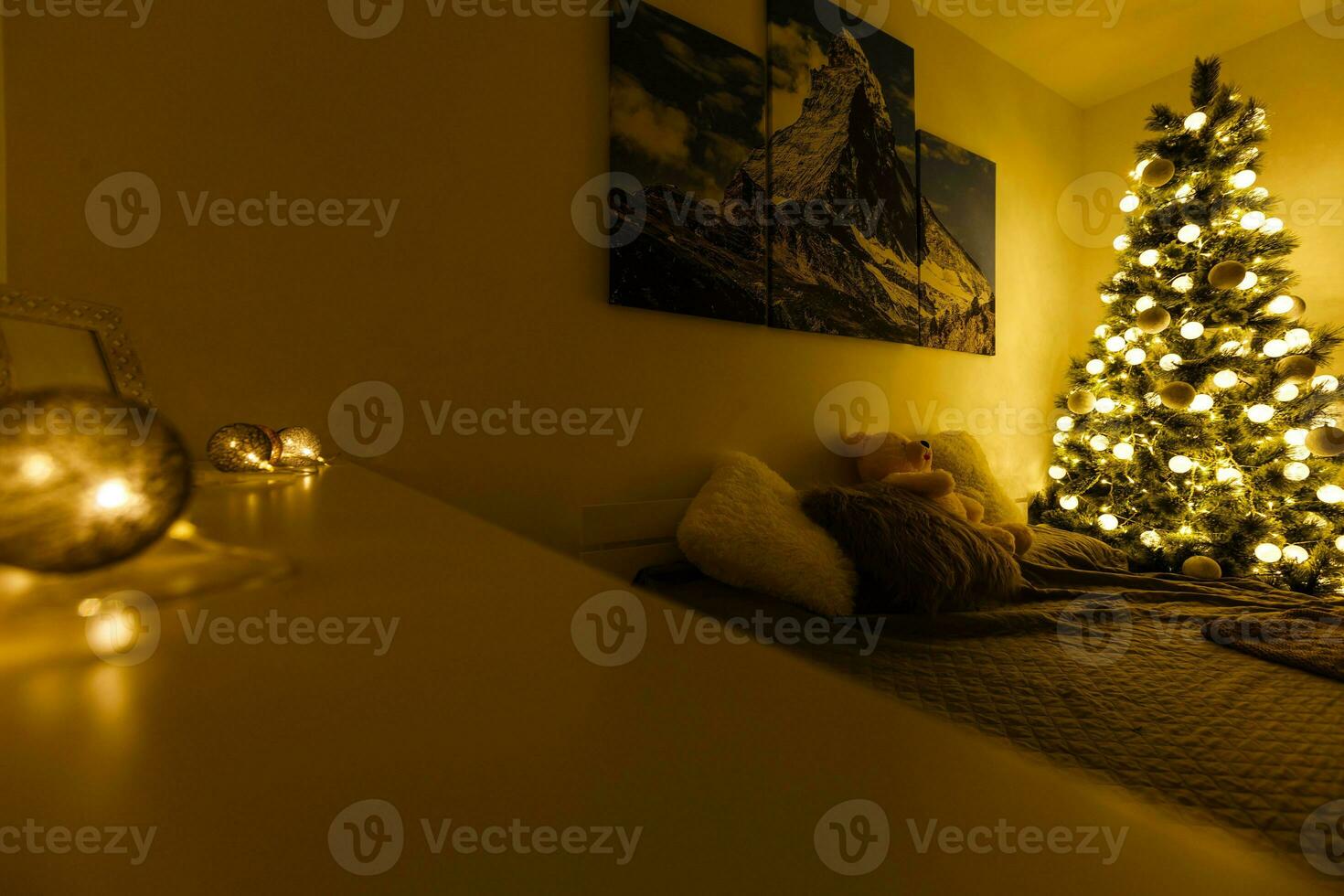 Illuminated Christmas tree decorated in modern living room photo