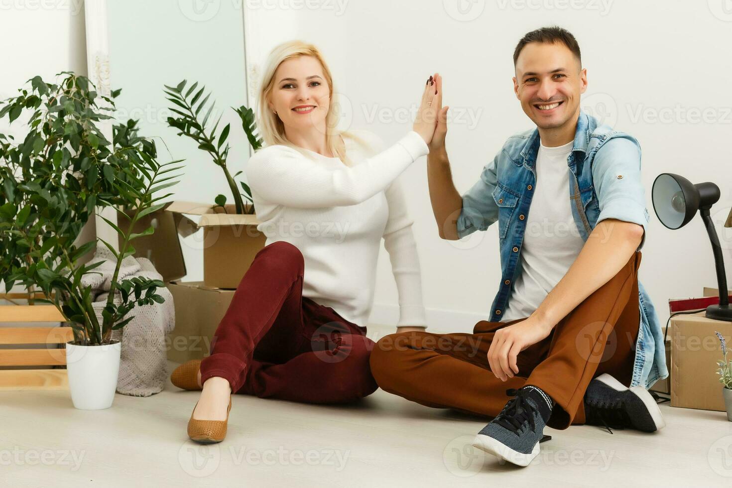 Happy young couple moving in new house photo
