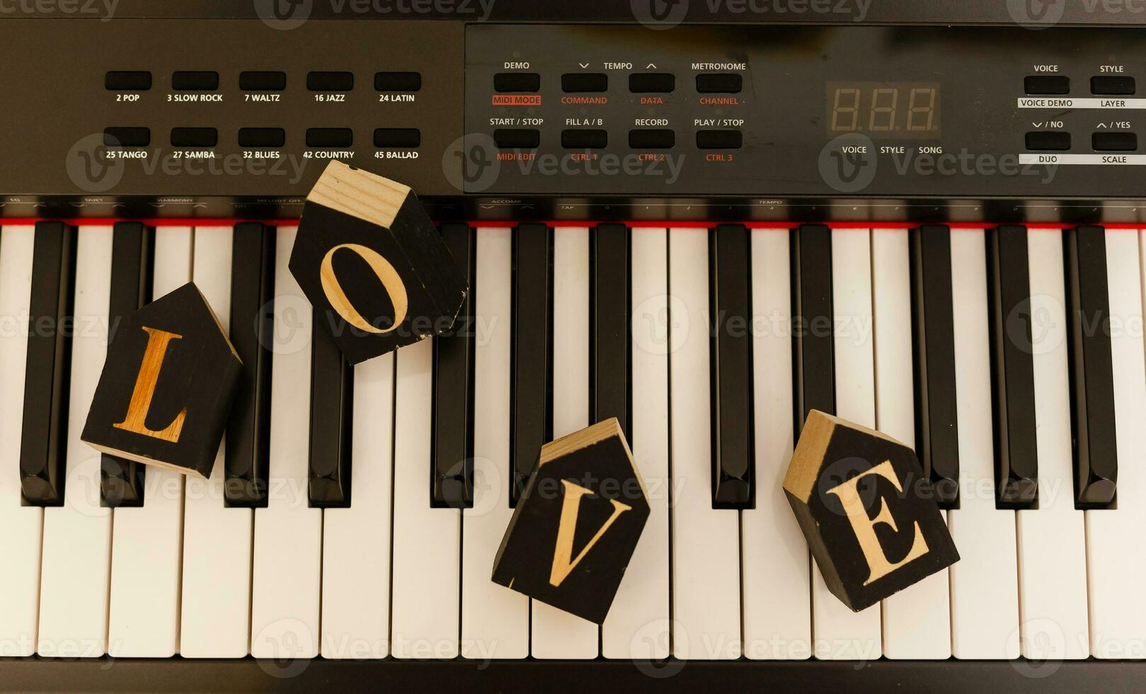 wooden word love on piano wedding concept photo