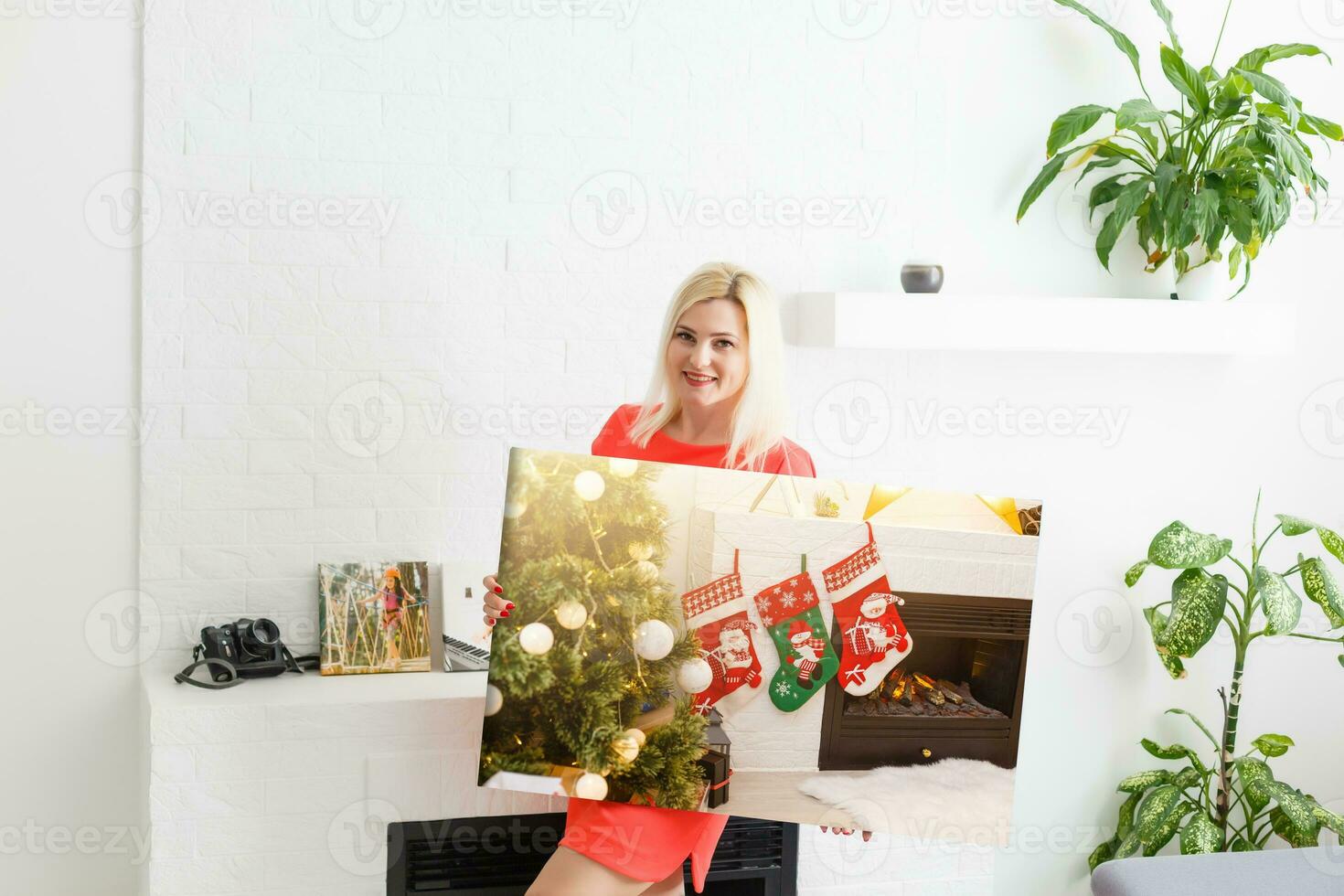 Canvas prints. A woman holding photo canvas. photo printed on glossy synthetic canvas and stretched on wooden stretcher bar