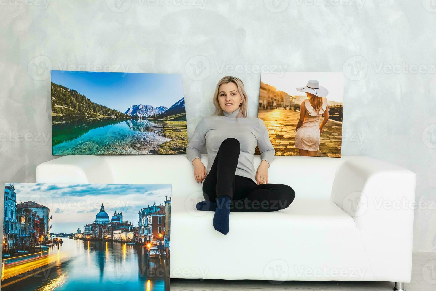 Cute businesswoman with long legs sitting on sofa photo