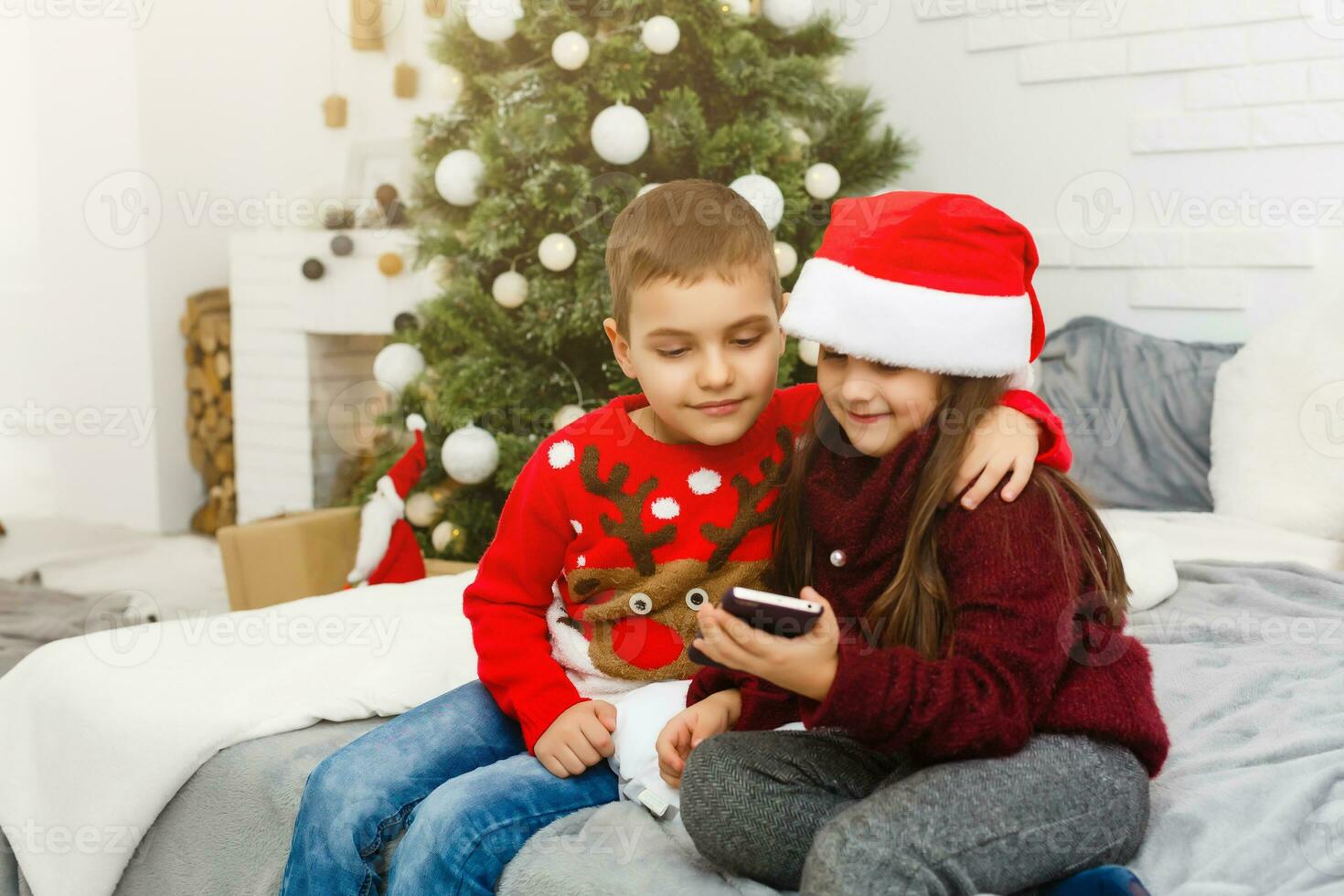 child playing in the mobile phone, children and smartphone. photo