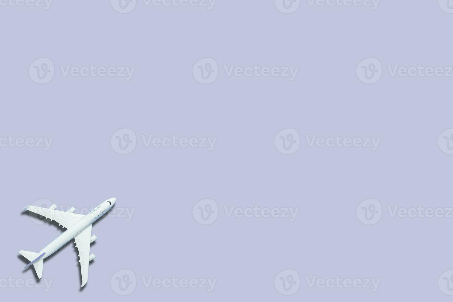 white airplane on a blue background, top view photo