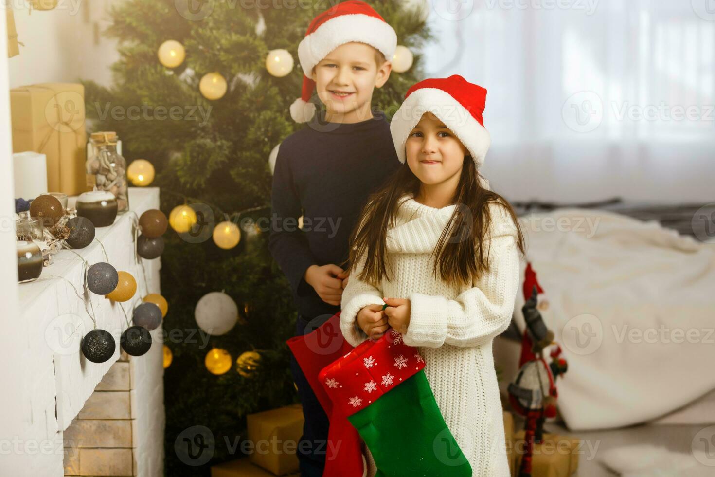 Christmas Kids. Happy Children Opening Gifts. New Year. Christmas Tree photo