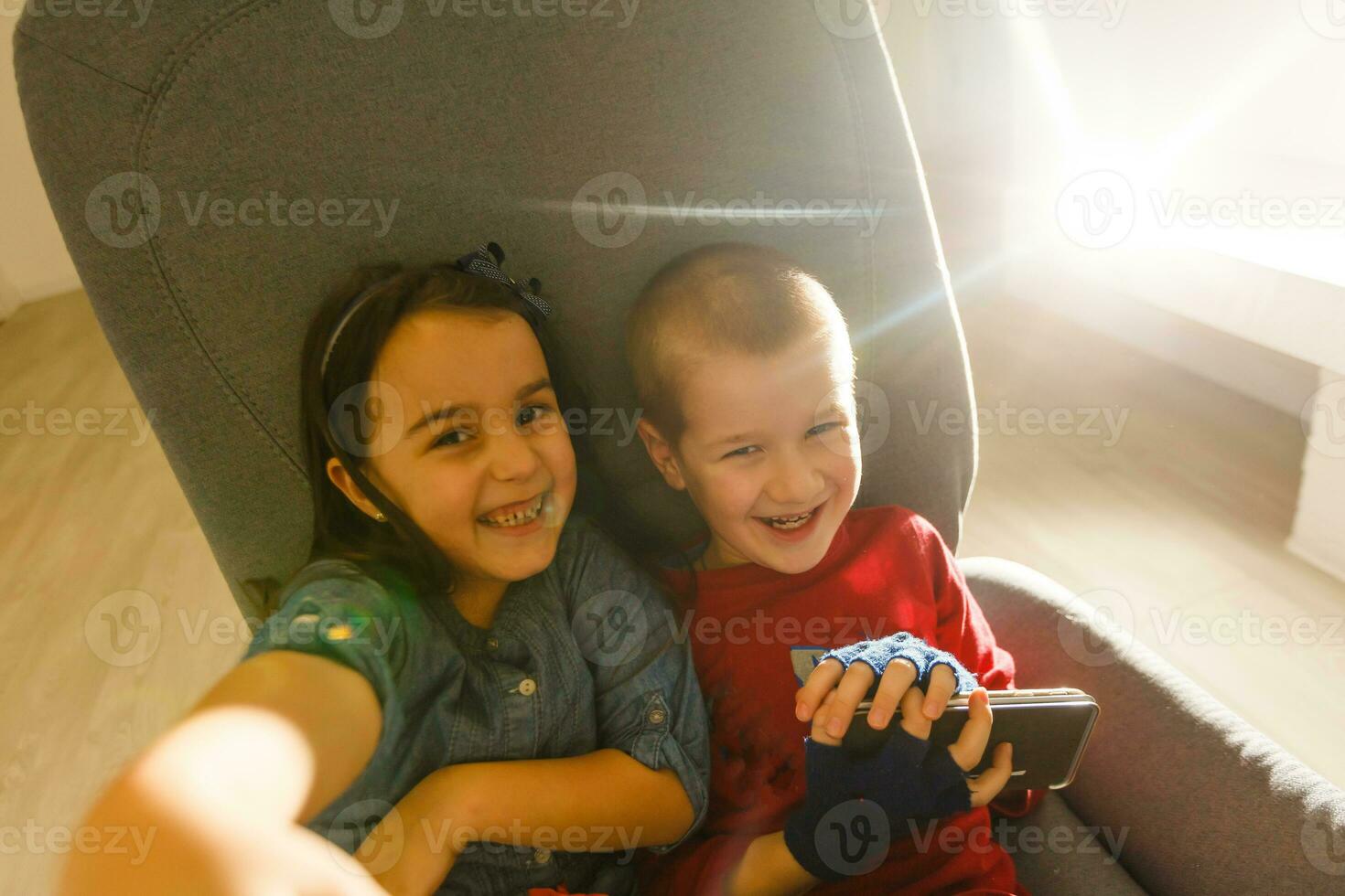 Group of happy children playing outdoors. Kids having fun Friends lying. Top view portrait photo