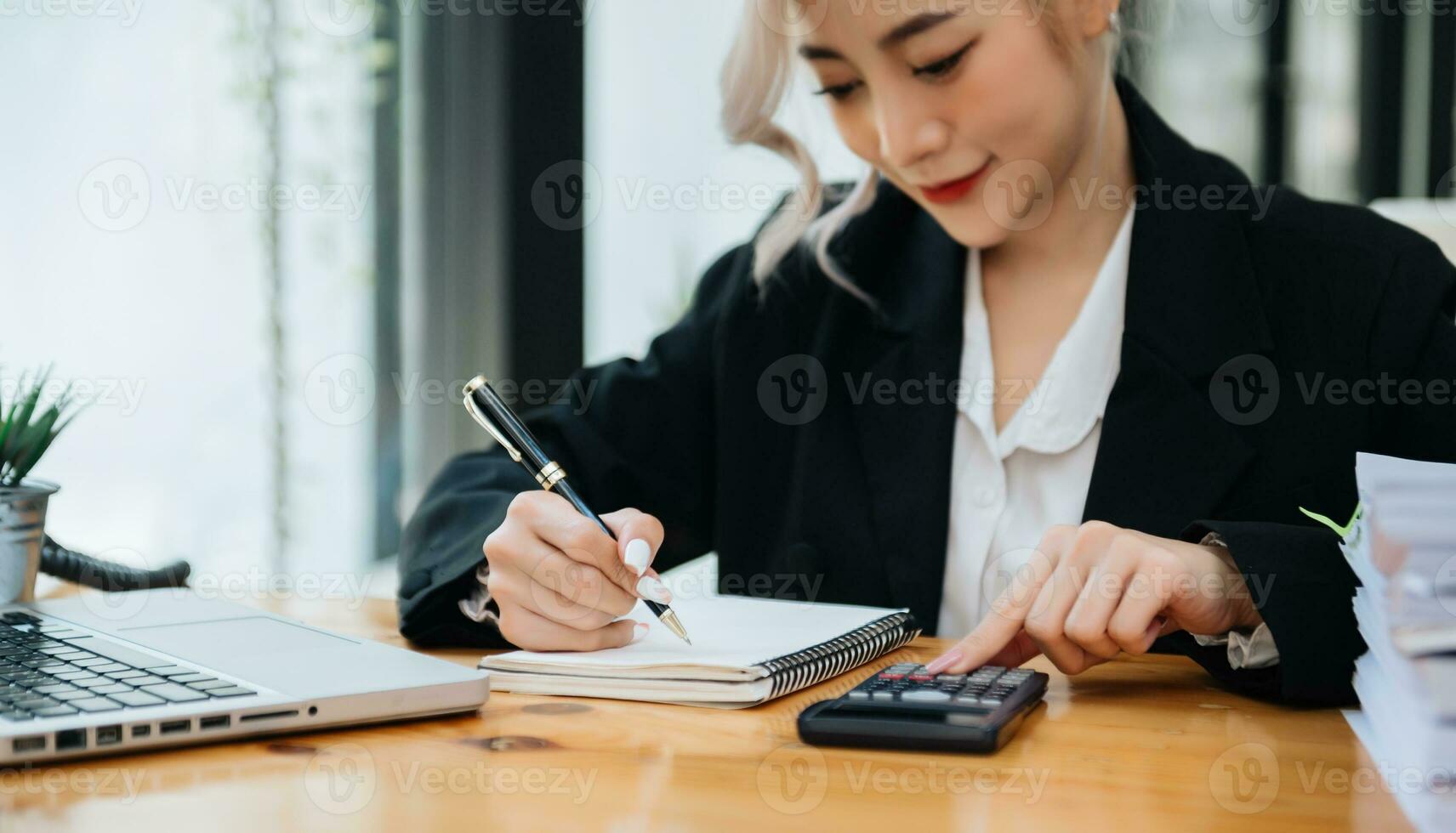 businessman hand working with new modern computer and writing on the notepad strategy diagram as concept photo
